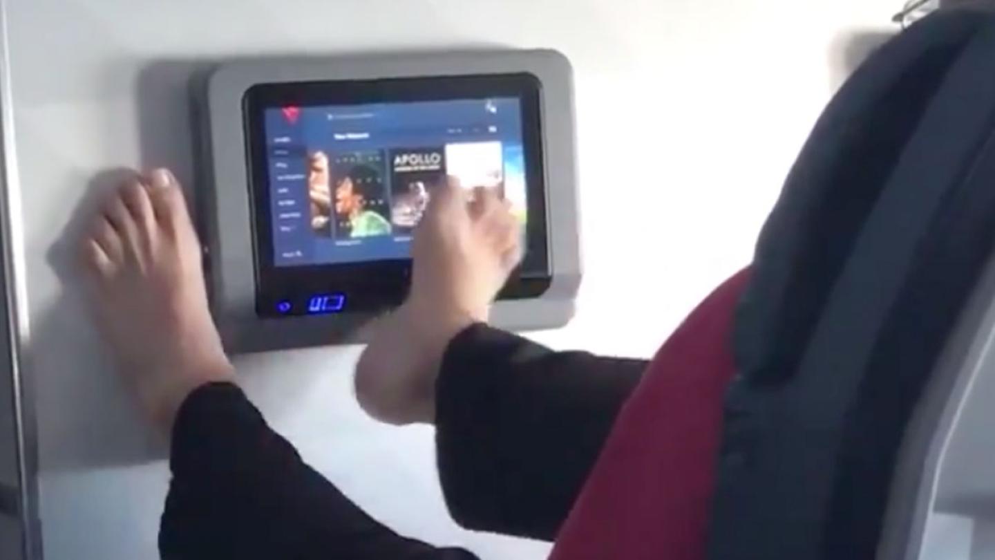 Disgusting Footage Shows Man Operating Plane TV With His FOOT!